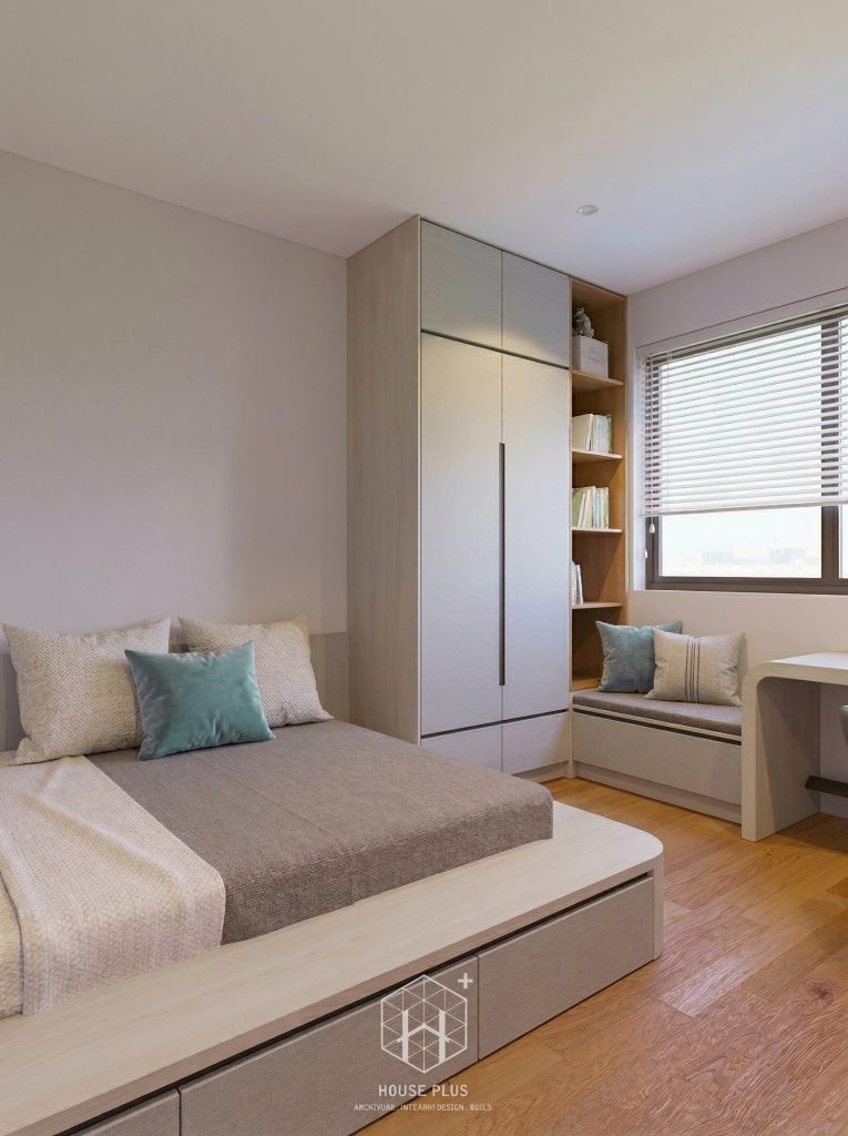 Sofa phụ trong phòng ngủ chung cư cạnh cửa sổ và hệ tủ màu sáng